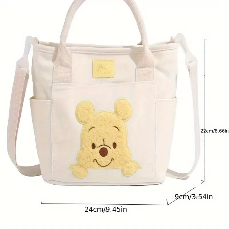 UME Winnie The Pooh Canvas Tote Bag - Cartoon Embroidered Crossbody Handbag with Honey Pot Charm, Zipper Closure, Dual Carry Handles, Canvas Lining, and Anime Animal Print Design - Perfect for Everyday Use