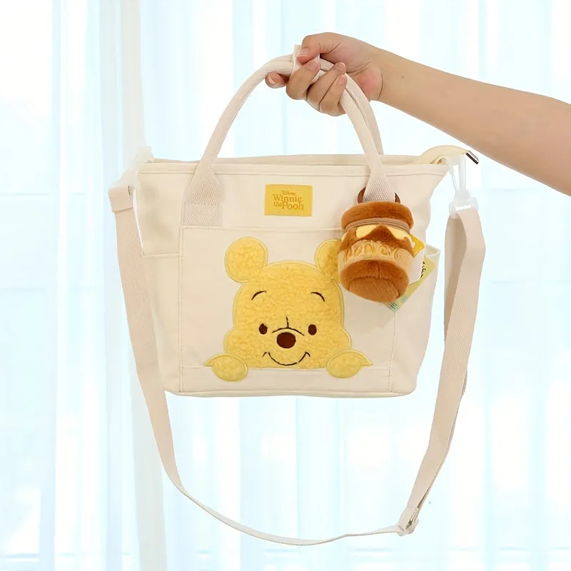 UME Winnie The Pooh Canvas Tote Bag - Cartoon Embroidered Crossbody Handbag with Honey Pot Charm, Zipper Closure, Dual Carry Handles, Canvas Lining, and Anime Animal Print Design - Perfect for Everyday Use