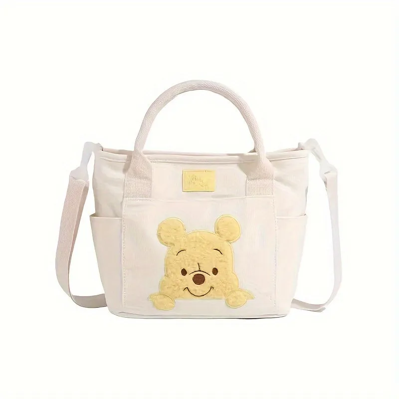 UME Winnie The Pooh Canvas Tote Bag - Cartoon Embroidered Crossbody Handbag with Honey Pot Charm, Zipper Closure, Dual Carry Handles, Canvas Lining, and Anime Animal Print Design - Perfect for Everyday Use